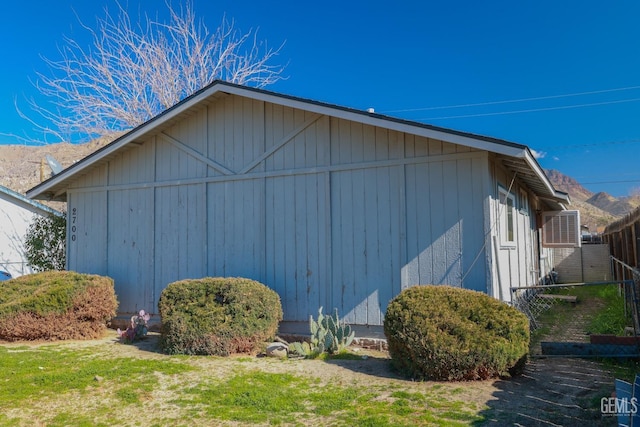 view of side of property with fence