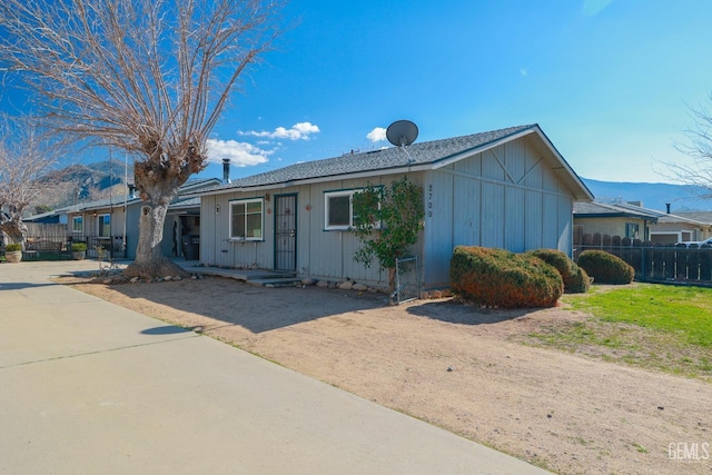 ranch-style house with fence