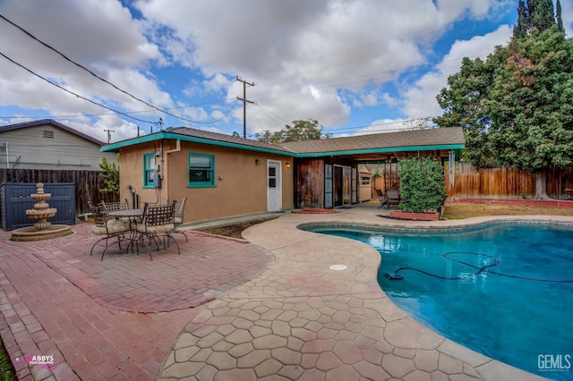 view of pool featuring a patio