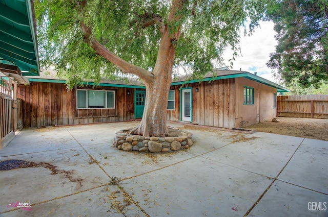 rear view of house featuring a patio