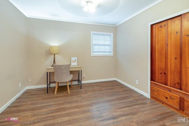 office with hardwood / wood-style flooring, ceiling fan, and ornamental molding