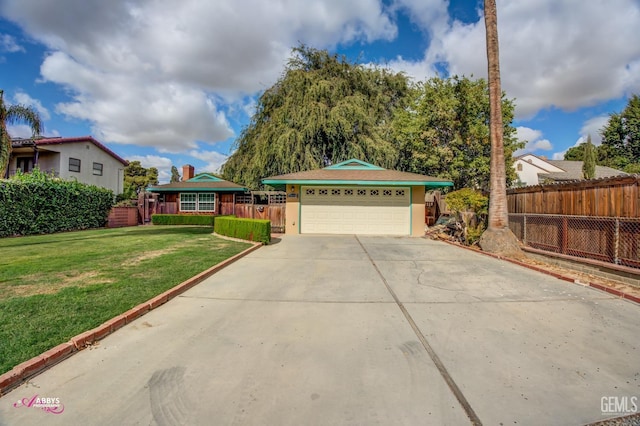 view of front of home featuring a garage and a front yard