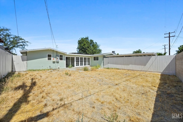 3117 Arnold St, Bakersfield, CA 93305 - back of house featuring a fenced backyard and stucco siding
