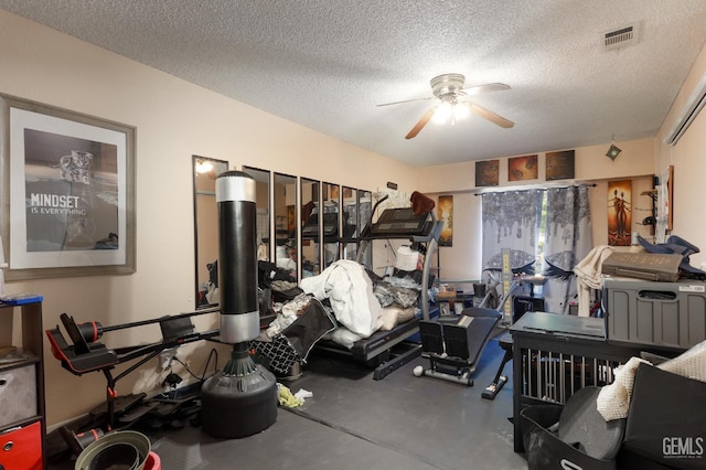 44827 Rock Island Dr, Lancaster, CA 93535 - workout room featuring ceiling fan and a textured ceiling