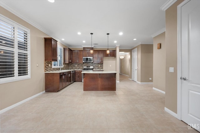 kitchen featuring light countertops, ornamental molding, tasteful backsplash, and stainless steel appliances