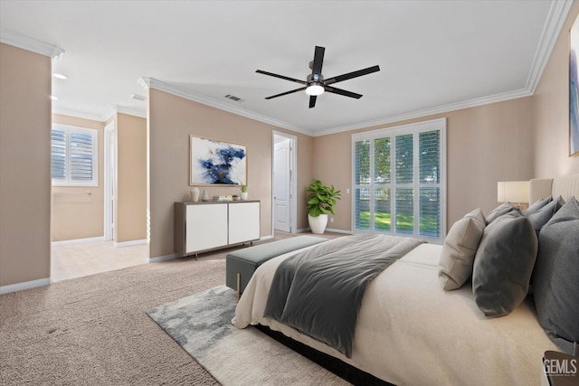 bedroom with visible vents, a ceiling fan, crown molding, baseboards, and light colored carpet