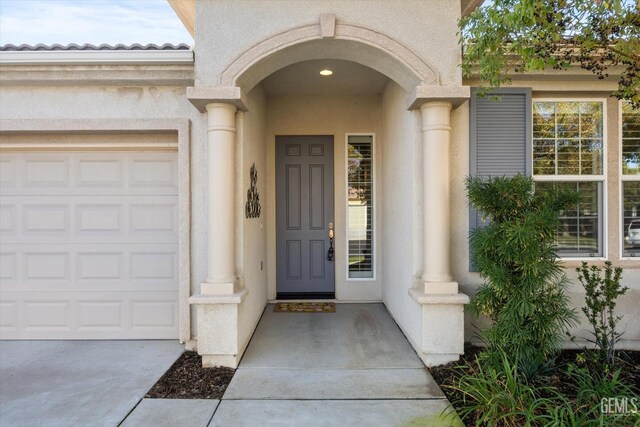 view of front of property with a front lawn and a garage