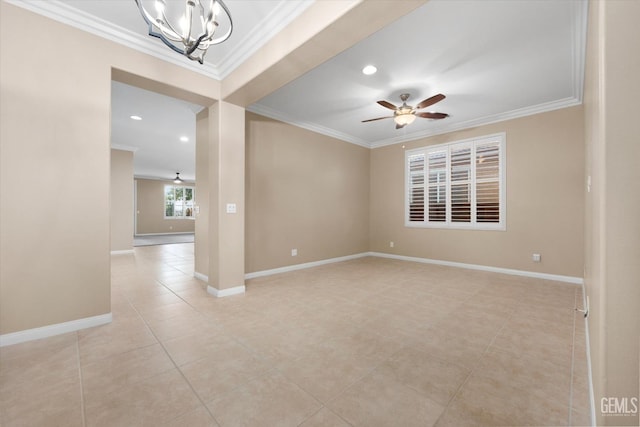 unfurnished room featuring crown molding, ceiling fan with notable chandelier, and baseboards