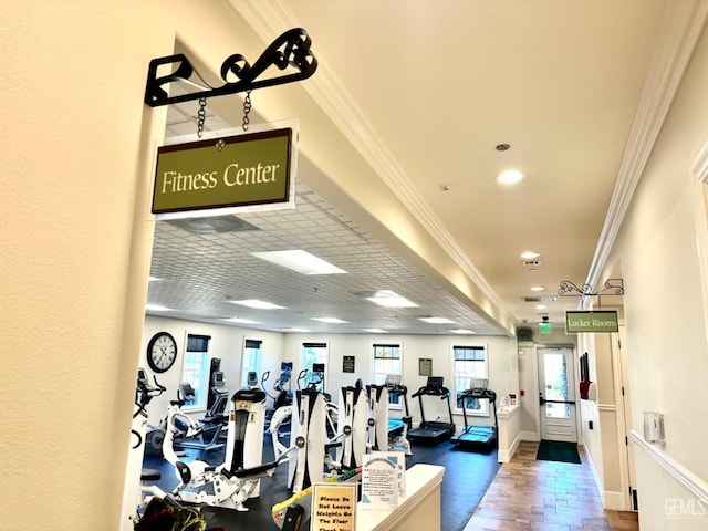 gym with recessed lighting, baseboards, and ornamental molding