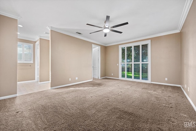 unfurnished room featuring ceiling fan, crown molding, visible vents, and light carpet