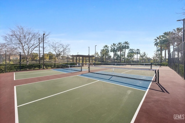 view of sport court with community basketball court and fence