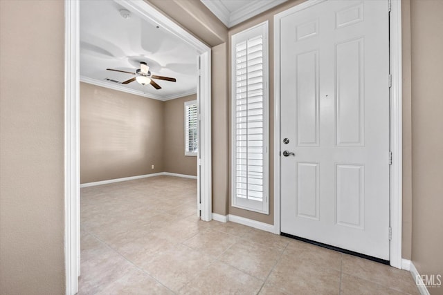 entrance foyer with light tile patterned flooring, baseboards, a ceiling fan, and ornamental molding