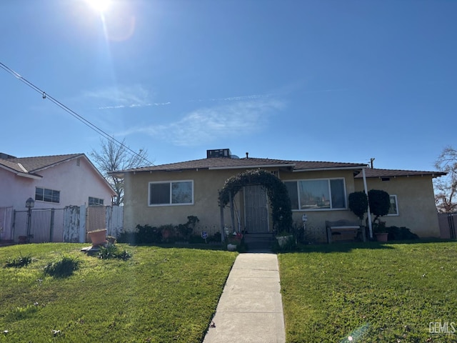 1105 Vanderbilt Dr, Bakersfield, CA 93305 - bungalow-style home with stucco siding and a gate