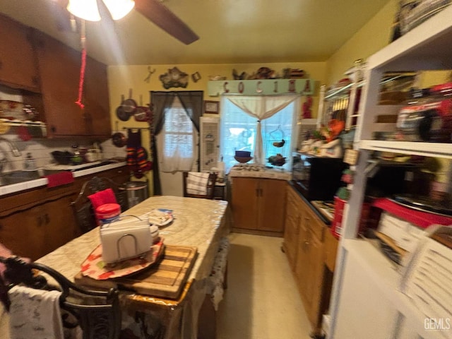 1105 Vanderbilt Dr, Bakersfield, CA 93305 - kitchen featuring a ceiling fan and light countertops
