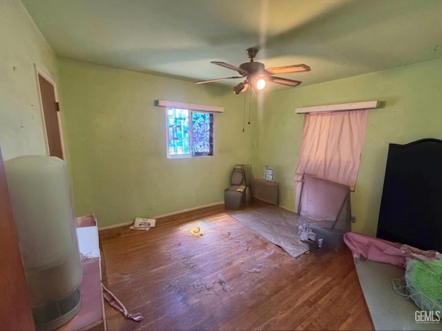 1105 Vanderbilt Dr, Bakersfield, CA 93305 - unfurnished bedroom with wood finished floors, a ceiling fan, and baseboards