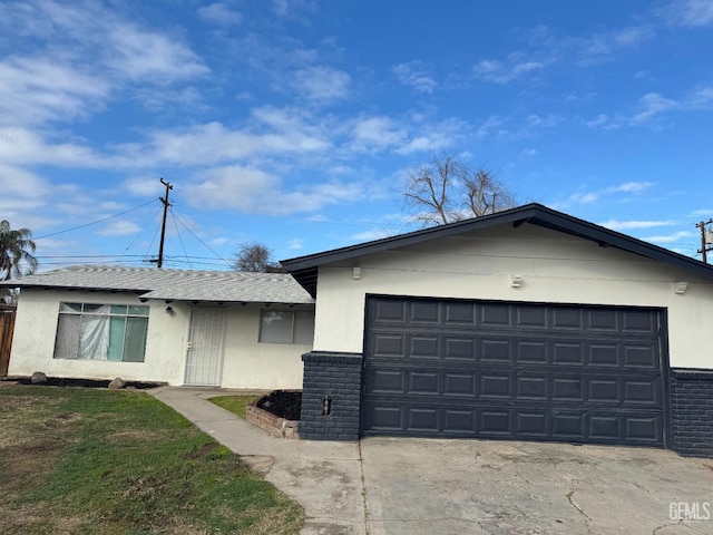 single story home featuring a garage