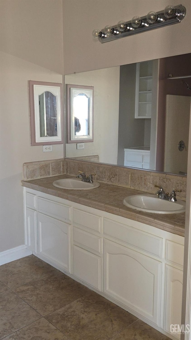 bathroom with vanity and tile patterned flooring