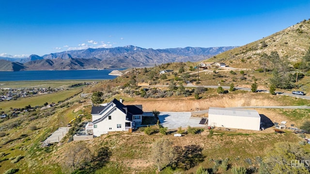 bird's eye view with a water and mountain view