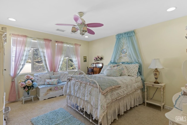 bedroom featuring ceiling fan and light carpet