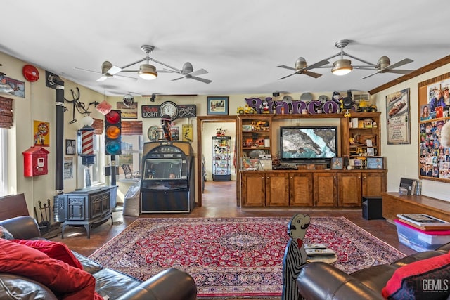 living room featuring a wood stove and crown molding