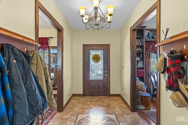 foyer with a chandelier