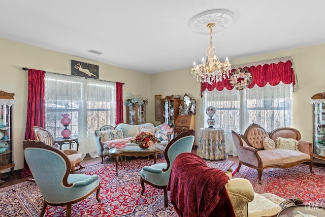 living room with an inviting chandelier