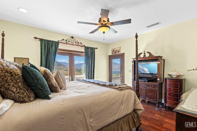 bedroom with french doors, access to outside, ceiling fan, and dark wood-type flooring