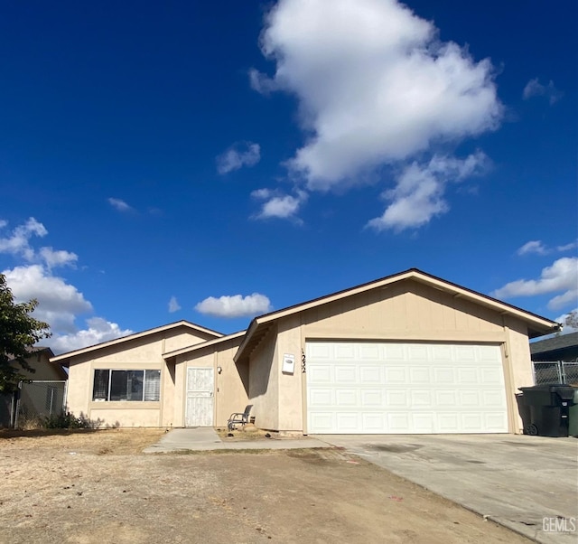 ranch-style home featuring a garage