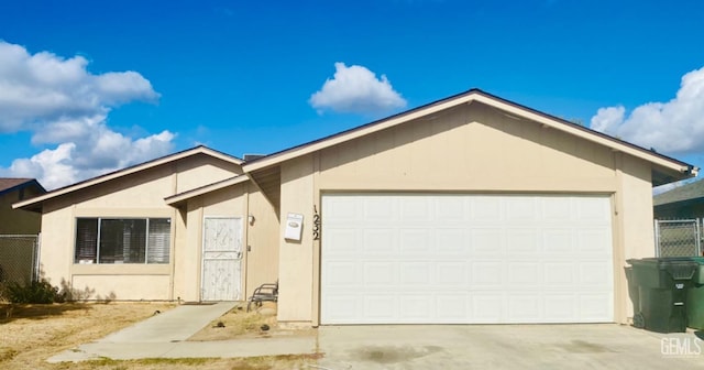 ranch-style home featuring a garage