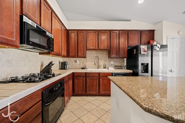13421 Cheyenne Mountain Dr, Bakersfield, CA 93314 - kitchen with black appliances, a sink, vaulted ceiling, backsplash, and light tile patterned flooring