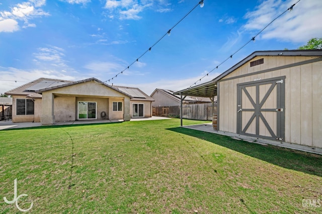 13421 Cheyenne Mountain Dr, Bakersfield, CA 93314 - rear view of house with a patio, solar panels, and stucco siding