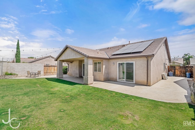13421 Cheyenne Mountain Dr, Bakersfield, CA 93314 - rear view of house with a patio, roof mounted solar panels, stucco siding, and a tile roof