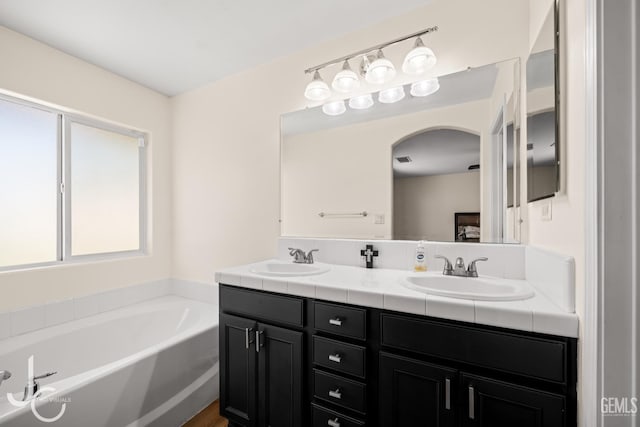 13421 Cheyenne Mountain Dr, Bakersfield, CA 93314 - full bathroom featuring double vanity and a bath