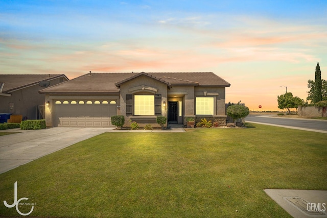 13421 Cheyenne Mountain Dr, Bakersfield, CA 93314 - view of front of home with a garage, driveway, stucco siding, and a front yard