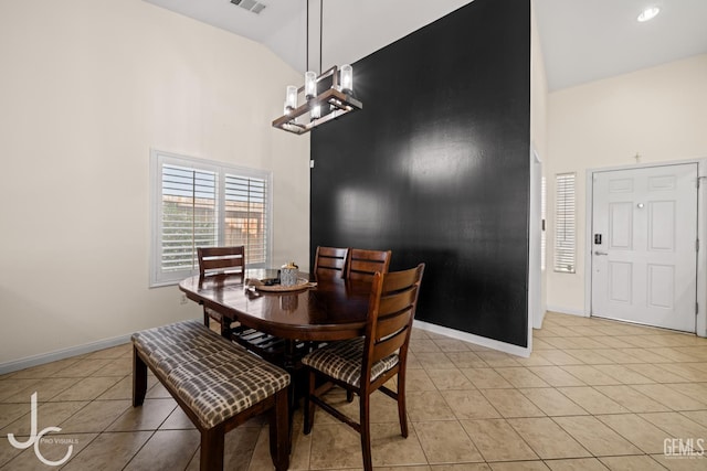 13421 Cheyenne Mountain Dr, Bakersfield, CA 93314 - dining room featuring light tile patterned flooring, high vaulted ceiling, baseboards, and a chandelier