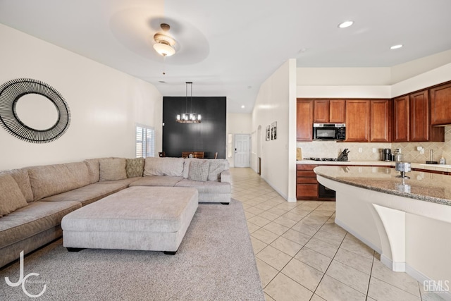 13421 Cheyenne Mountain Dr, Bakersfield, CA 93314 - living area featuring a chandelier, light tile patterned floors, a ceiling fan, and recessed lighting