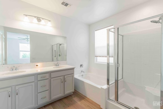 14209 Boon Way, Bakersfield, CA 93311 - bathroom featuring ceiling fan, vanity, independent shower and bath, and hardwood / wood-style floors
