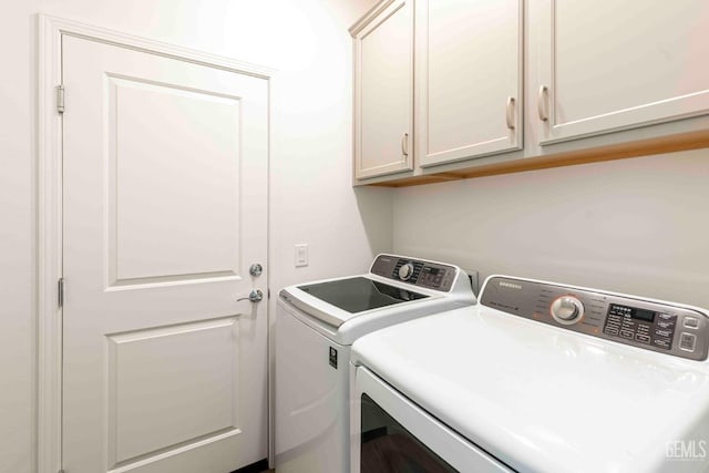 14209 Boon Way, Bakersfield, CA 93311 - clothes washing area with cabinets and washer and clothes dryer