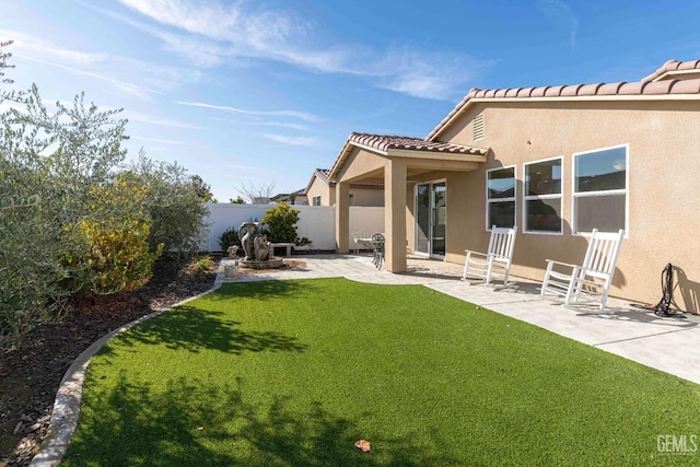 14209 Boon Way, Bakersfield, CA 93311 - back of property featuring a yard and a patio area