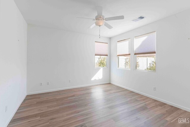 14209 Boon Way, Bakersfield, CA 93311 - empty room with hardwood / wood-style floors and ceiling fan