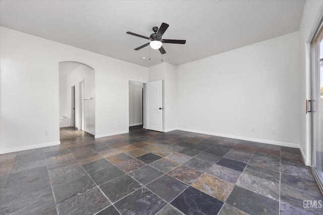 unfurnished room with ceiling fan