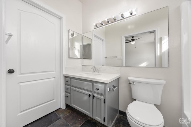 bathroom with vanity, ceiling fan, and toilet