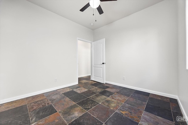 unfurnished room with ceiling fan