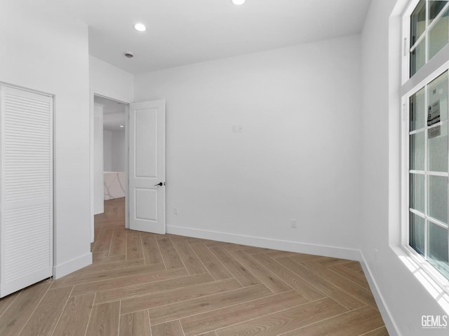 unfurnished bedroom featuring baseboards and recessed lighting