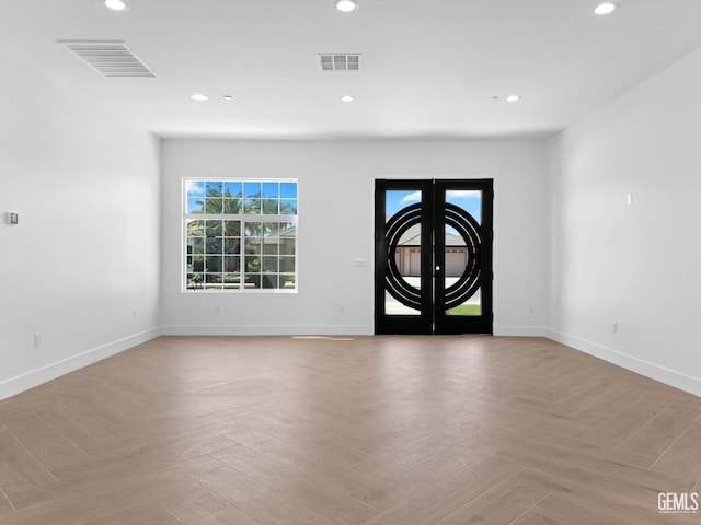 foyer with recessed lighting, visible vents, and french doors