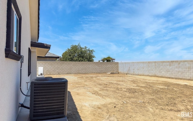 view of yard featuring a fenced backyard and cooling unit