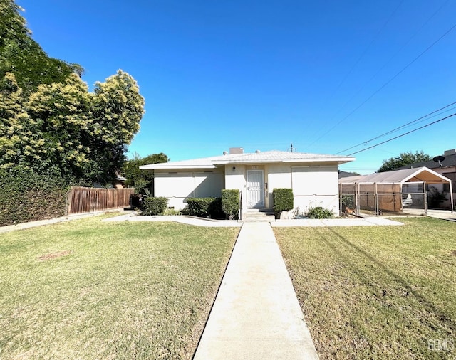 view of front of property with a front lawn