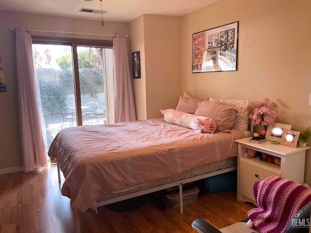 4747 W Iris Ave, Visalia, CA 93277 - bedroom with access to exterior, visible vents, baseboards, and wood finished floors