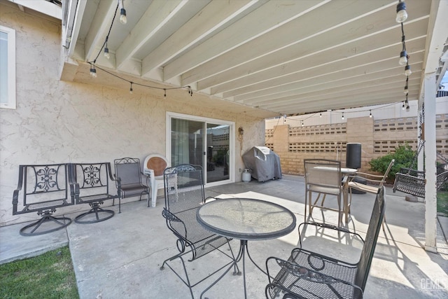 view of patio with a grill