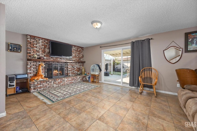 living room with heating unit, a textured ceiling, and a brick fireplace